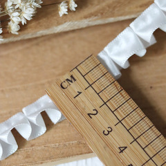 White satin ribbon, three-dimensional tightly pleated mini doll clothing—handcrafted with delicate lace trim and a stand-up collar, featuring a flared skirt silhouette.