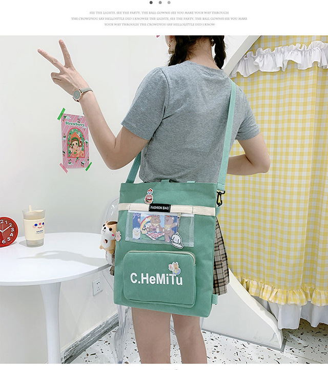 Korean-style canvas bag for girls with one shoulder, in the style of Harajuku, ulzzang, with a large capacity and contrasting colors, is a crossbody hand-held schoolbag for classes undefined