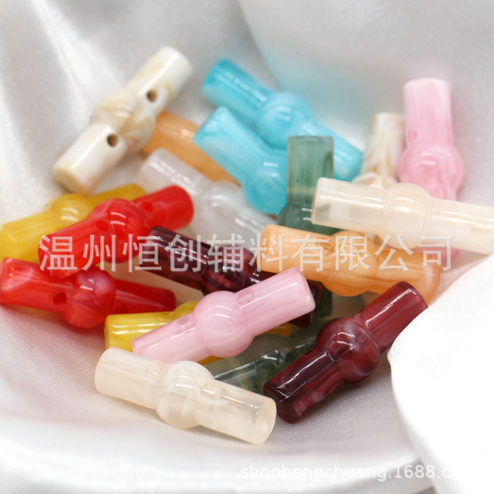 25x9mm brillante Hengchuang botón de resina cilíndrica de dos agujeros botón de estilo nacional suéter de punto botón de color de bricolaje al por mayor