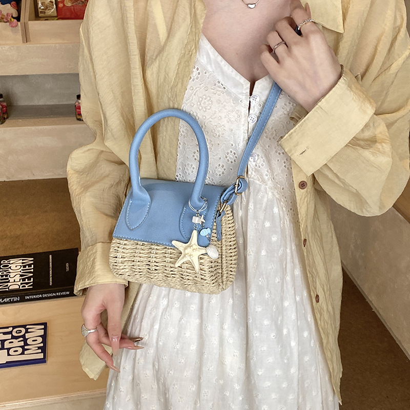 Mini bolso nuevo verano 2026 tela de paja de moda nicho sensación diaria bolso de hombro bolso de mochila