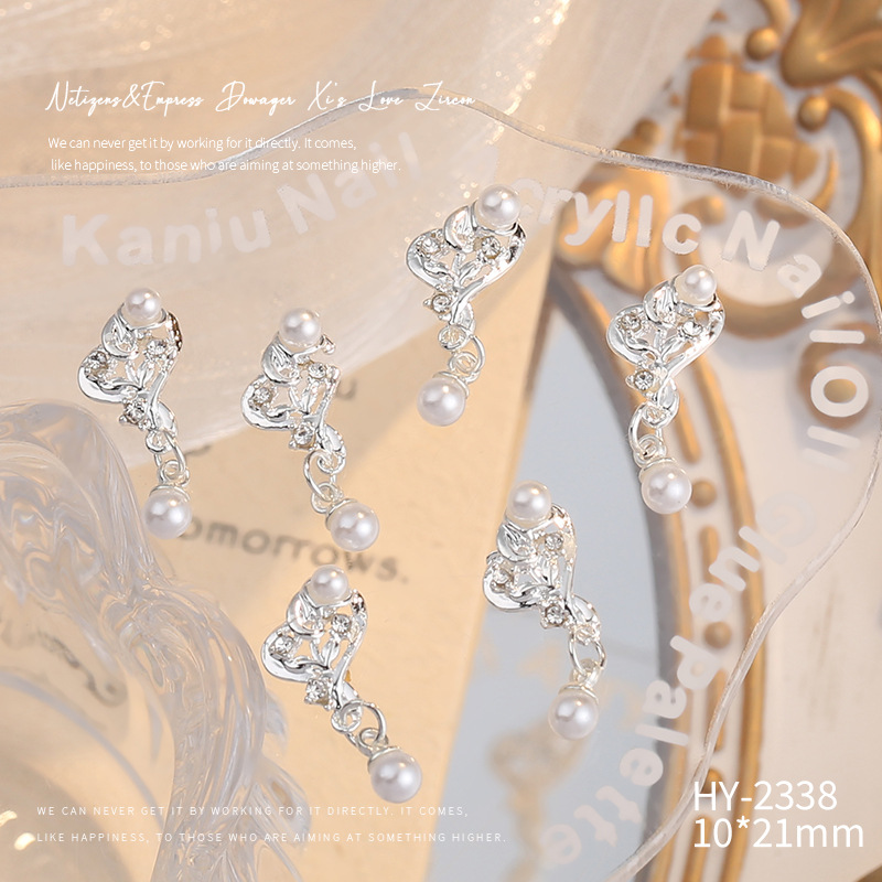 Nueva joyería de aleación de manicura completa diamante borla arco corona plata uñas manicura joyería accesorios al por mayor