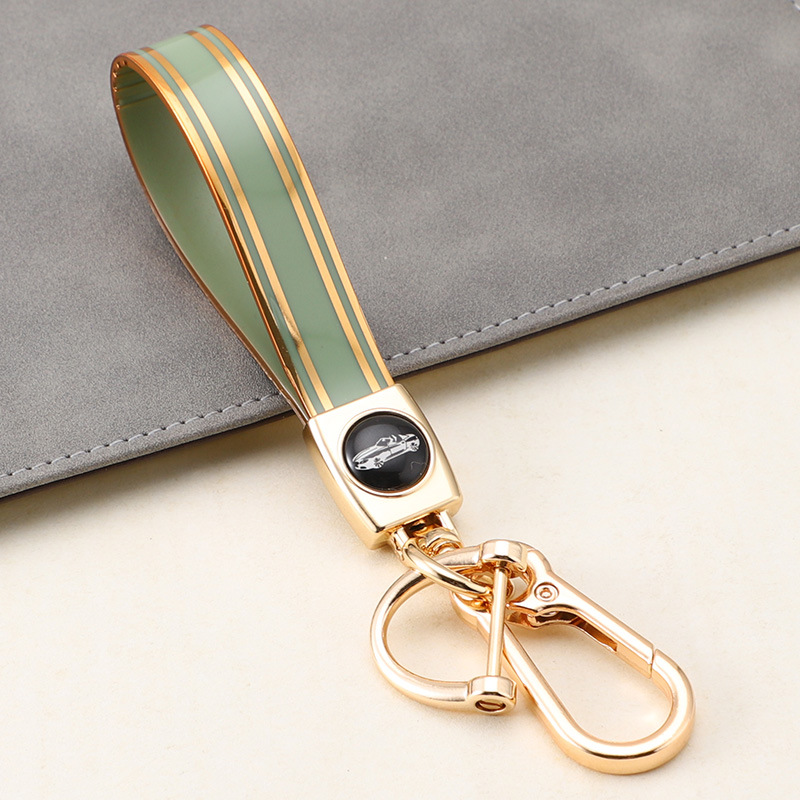 Cuerda de mano de silicona transfronteriza llavero de coche logotipo de coche apellido llavero anti-pérdida llavero de cuerda de mano de silicona duradera