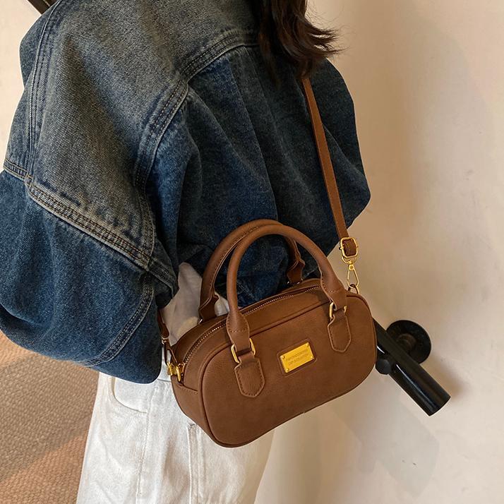 Bolso de bolos de mano de moda 2024 nuevo bolso de mujer retro simple bolso de hombro de alta calidad bolso de mochila universal mujer