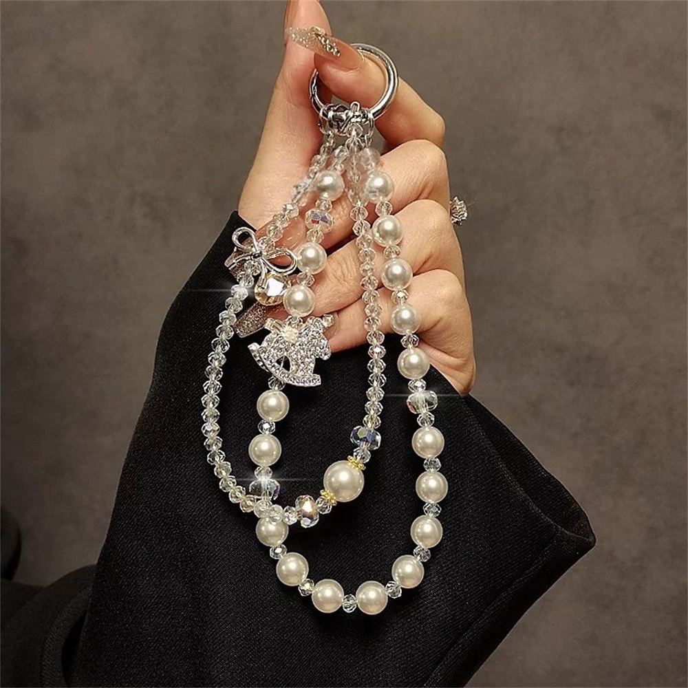 Hot-selling full-diamond pony phone charm, crystal pearl beaded pendant, double chain, high-end niche ornament wholesale.