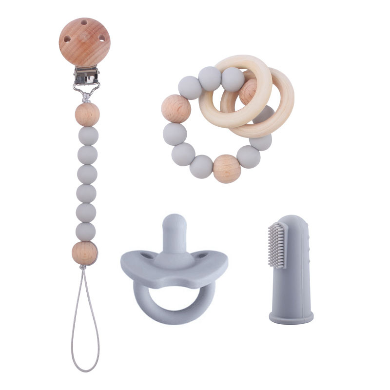 Nuevo bebé suministros de silicona de cuatro piezas conjunto chupete bebé silicona pezón pulsera dedo manga cepillo de dientes pezón cadena