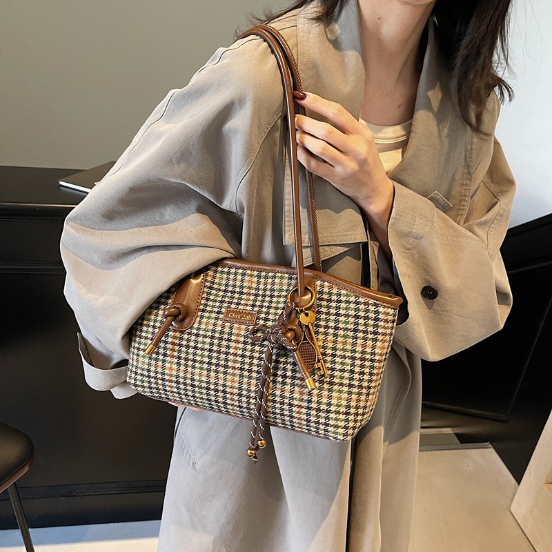 Coreano 1000 pájaros estilo extranjero hombro brazo bolso de viaje de gran capacidad para mujeres 2025 nuevo bolso de moda