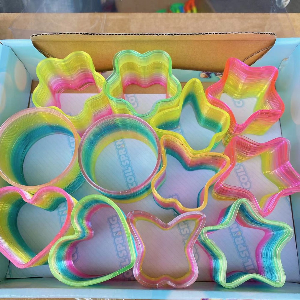 Juguetes para niños anillo de arco iris de forma especial anillo elástico bobina anillo superpuesto regalo para jardín de infantes para niños y niñas puzzle
