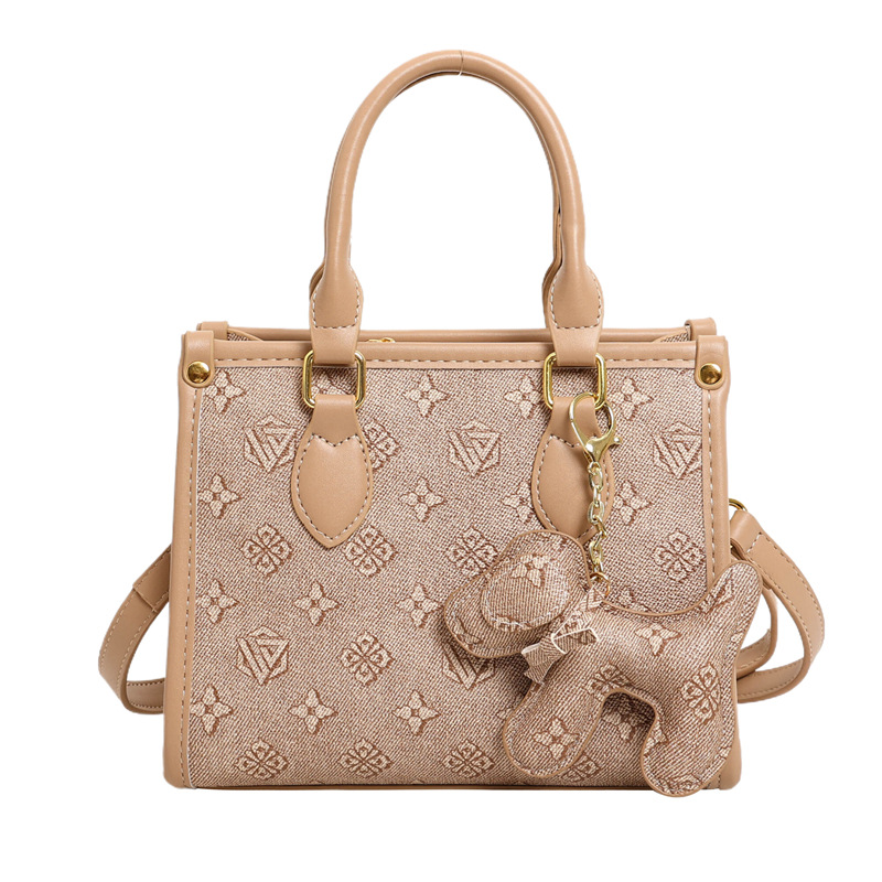 Bolsos clásicos de presbiterio con estampado de letras Bolsos tote Bolsos retro europeos y americanos al por mayor transfronterizos Bolsos de hombro con textura de todo fósforo