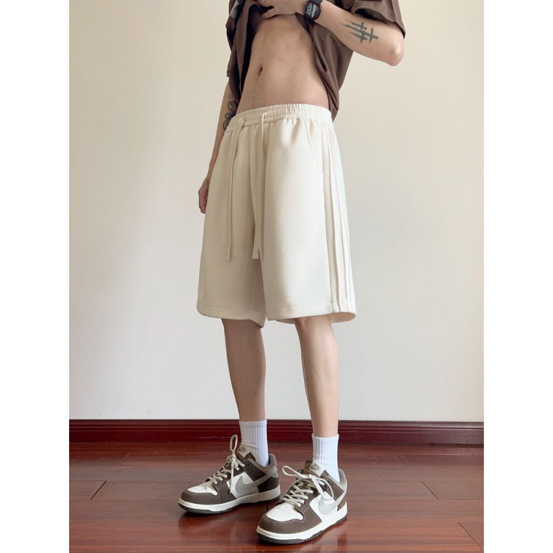 Pantalones cortos para hombres de verano delgados 2024 nuevos pantalones casuales de cinco puntos de moda pantalones deportivos de piernas largas sueltos para hombres