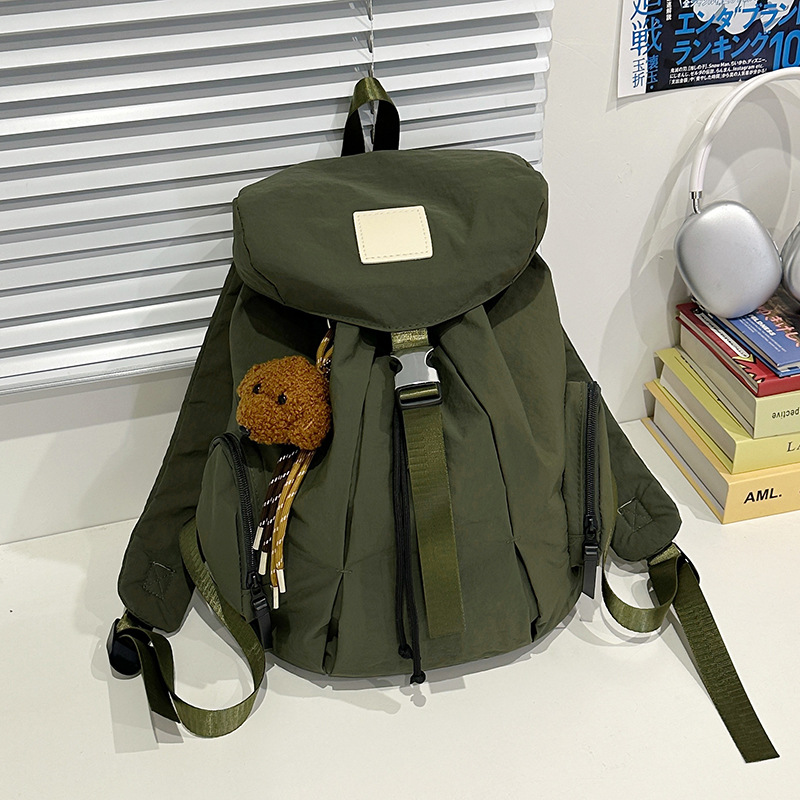 Mochila de nylon de color sólido coreano a prueba de agua de gran capacidad para parejas de viajes casuales ultraligero mochila de moda cool