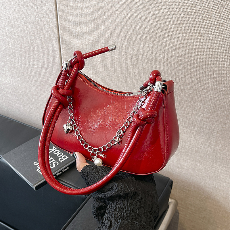 Bolsa de moda de media luna para mujeres 2024 bolso de hombro simple coreano de estilo nicho sensación de moda bolso de mujer casual