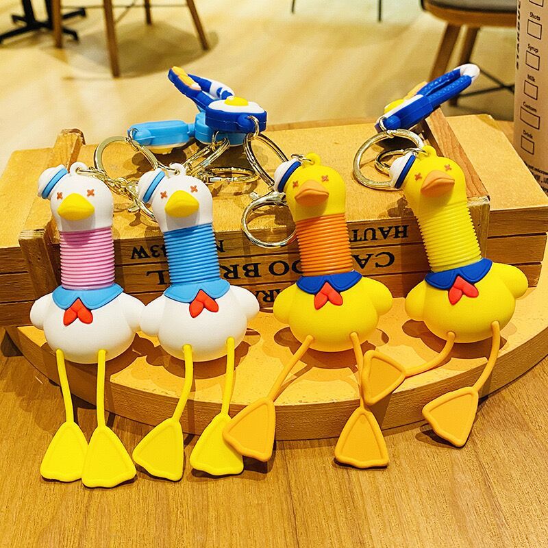 Llavero de cuello telescópico creativo de dibujos animados Divertido colgante de bolsa de descompresión colgante de coche cadena anillo pequeño regalo al por mayor