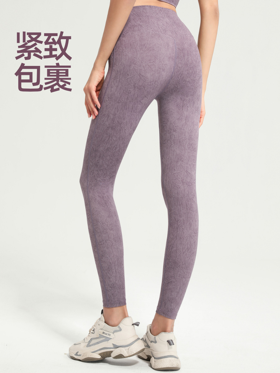 Pantalones de yoga europeos y americanos de verano de cintura alta delgada de levantamiento de cadera de camuflaje desgaste exterior deportes ajustados melocotón pantalones de cadera ropa de fitness para mujeres
