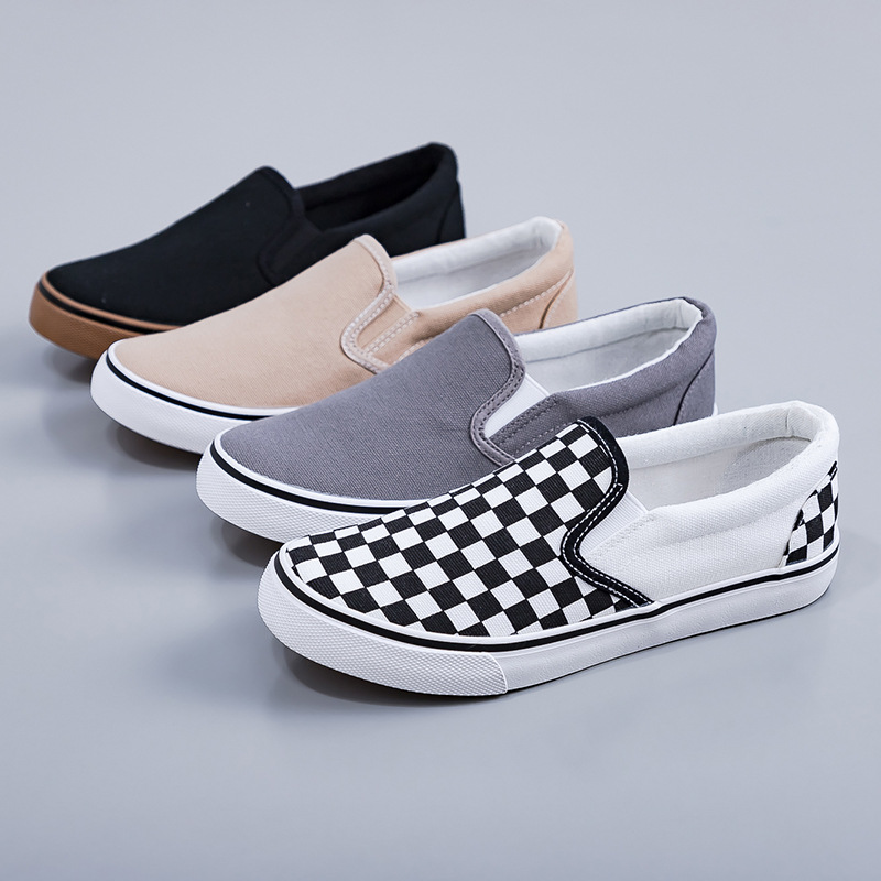 Hombres y mujeres zapatos de lona a cuadros negros y blancos de primavera 2026 nuevos zapatos deportivos casuales de estudiantes de estilo coreano tablero de ajedrez zapatos de skate para parejas