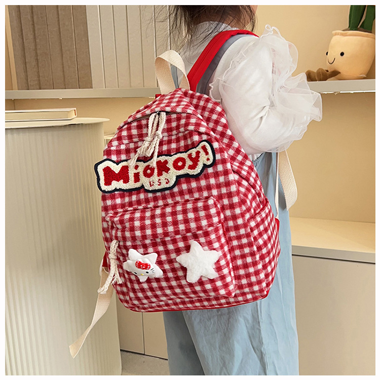 The large-capacity red woolen checkered backpack for primary and secondary school students is a unique and versatile choice. It's a trend for girls to carry backpacks during their leisure trips undefined