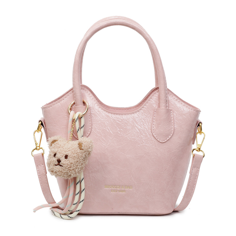 Versión coreana del bolso de cubo de mano casual simple para mujer 2025 nuevo bolso de hombro de viajero de todo fósforo bolso de mensajero de tendencia de moda