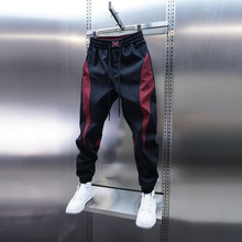 新款男款裤子春秋款潮牌小脚九分裤拼接男裤红色休闲裤束脚哈伦裤