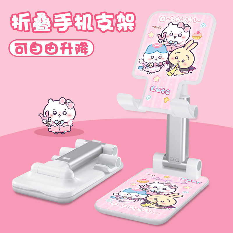 Kt猫の漫画の携帯電話の支柱はタブレットの怠け者のデスクトップの新型の生放送のネット課の神器のベッドの頭の折り畳みの支柱を適用します。|undefined