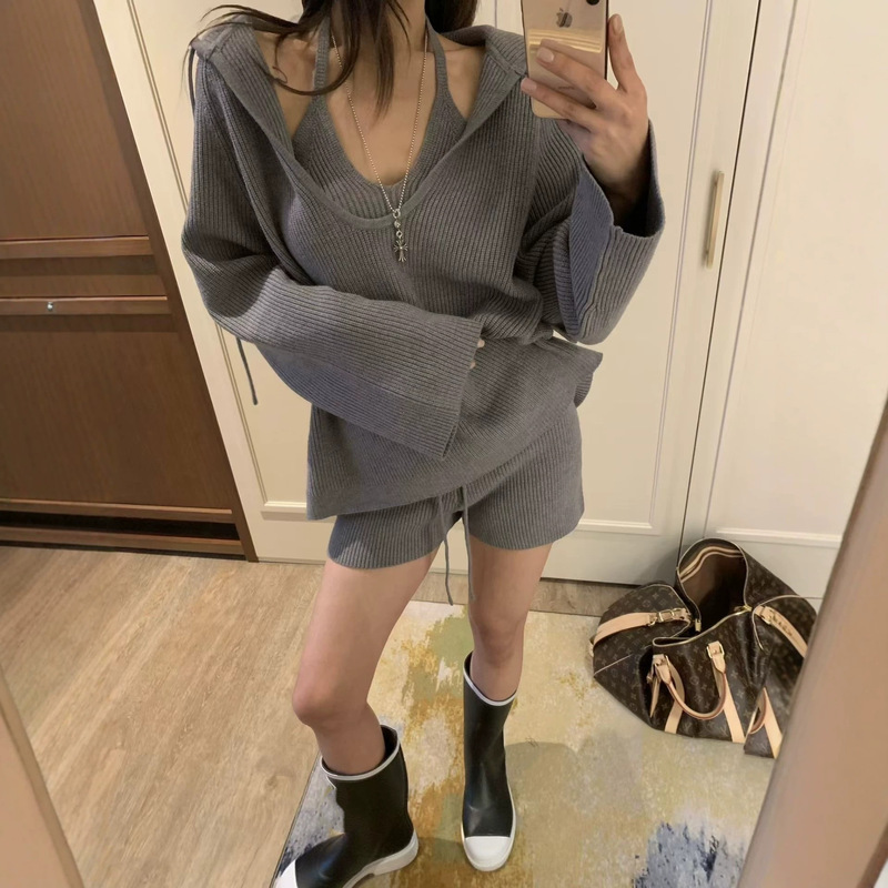 Autumn and winter simple design, stylish knitted outfit for women, including a halter neck vest, hooded sweater, and shorts as a complete set Autumn and winter simple design, stylish knitted outfit for women, including a halter neck vest, hooded sweater, and shorts as a complete set