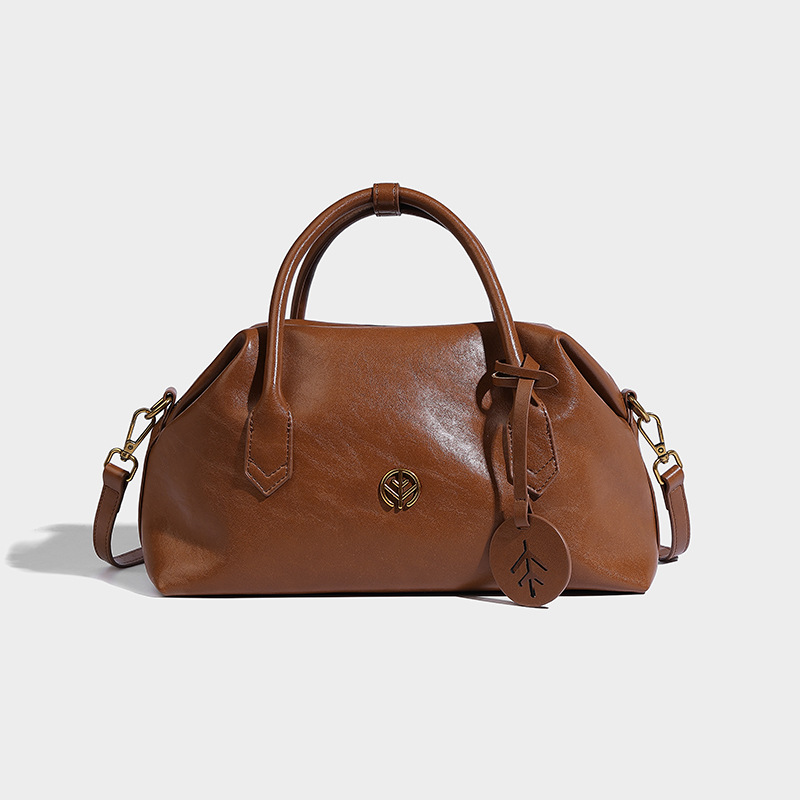 Bolsos de Boston de piel bronceada vegetal retro bolsos de bolera portátiles bolsos de mujer otoño e invierno 2024 nuevos bolsos de Usnea de hombro único