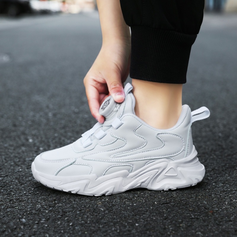 Zapatos blancos para niños ventilados primavera-verano 2026 nuevos zapatos blancos para niños botones giratorios de zapatos blancos para niñas