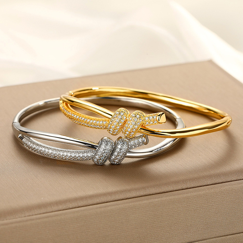Cross-border knotted diamond bracelet, a luxurious piece featuring full cubic zirconia, a cross-shaped clasp, and a twisted design, plated with real gold for a high-end look