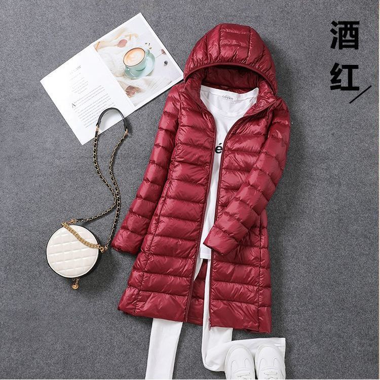 Tik Tok transfronterizo otoño y invierno nuevo chaqueta de plumón ligera de mujeres mediana y larga ropa blanca coreana chaqueta delgada sombrero desmontable