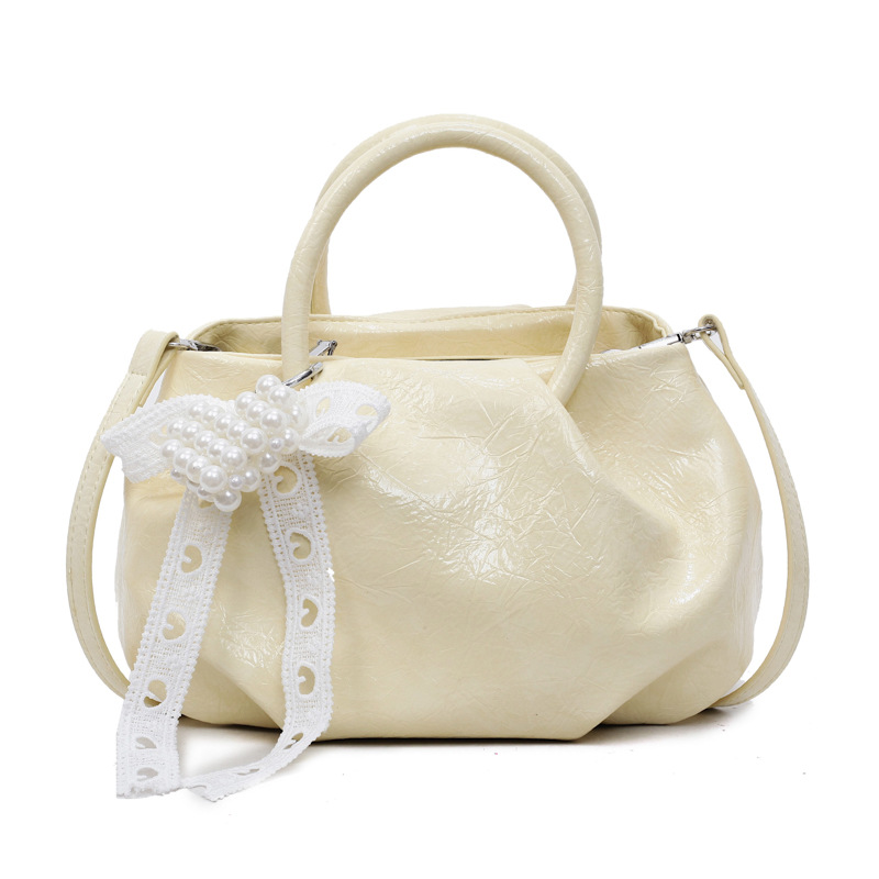 Bolso de diseño de nicho 2025 verano nuevo bolso femenino bolso de hombro de textura de alta gama bolso de mensajero de patrón de agarre de mano de moda