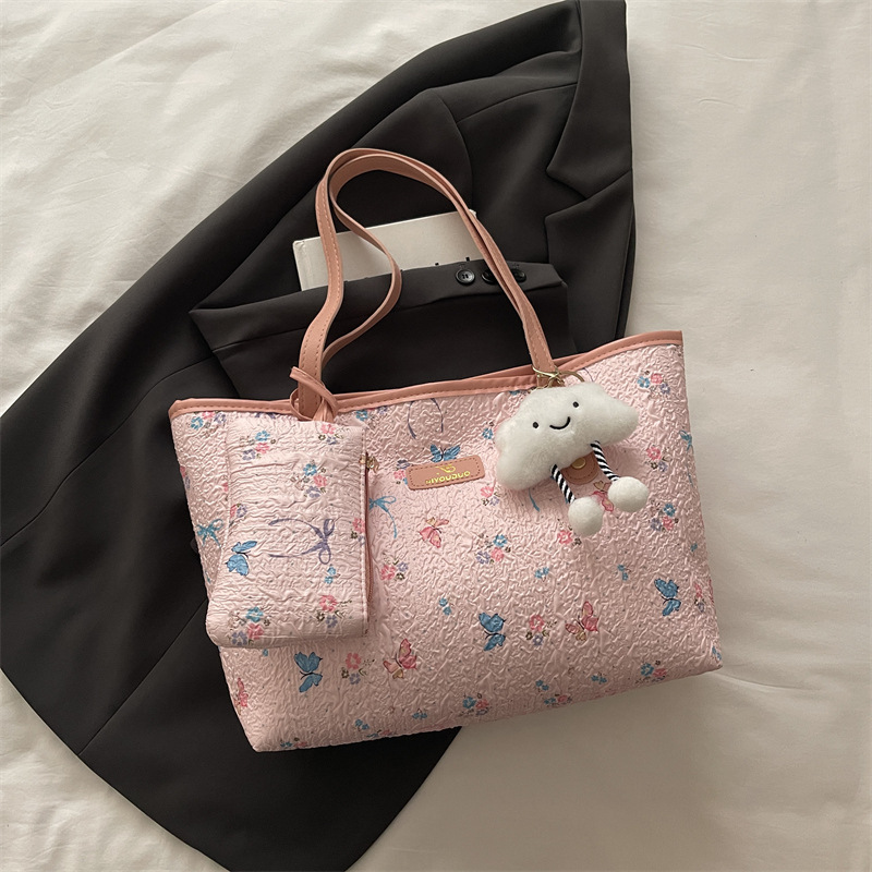 2026 flores coreanas mariposas de gran capacidad de viaje de primavera nueva moda moda extranjera bolso de hombro