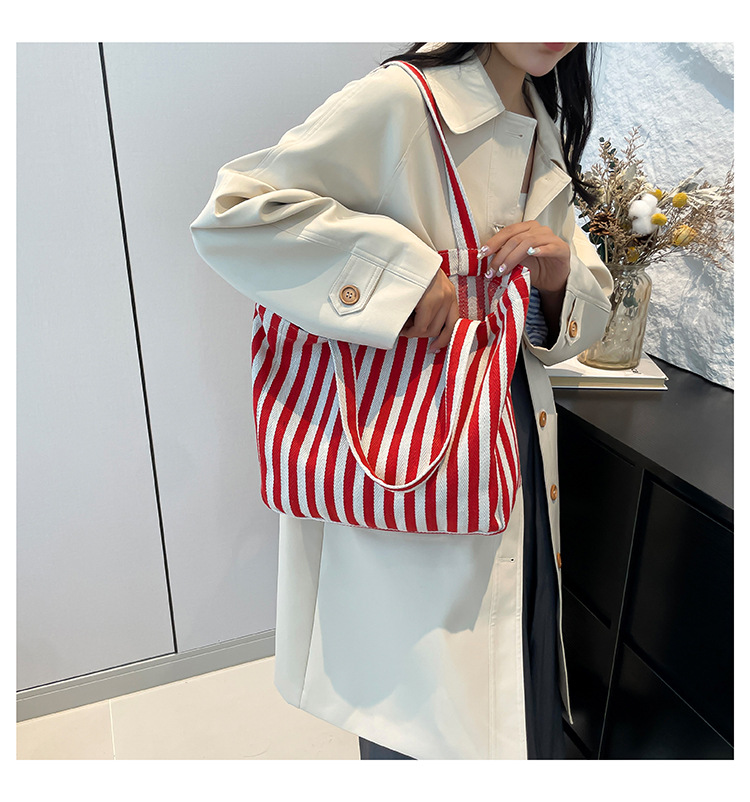 2024 Autumn/Winter new versatile and fashionable striped handbag shopping bag, two-tone large-capacity trendy single-shoulder bag undefined