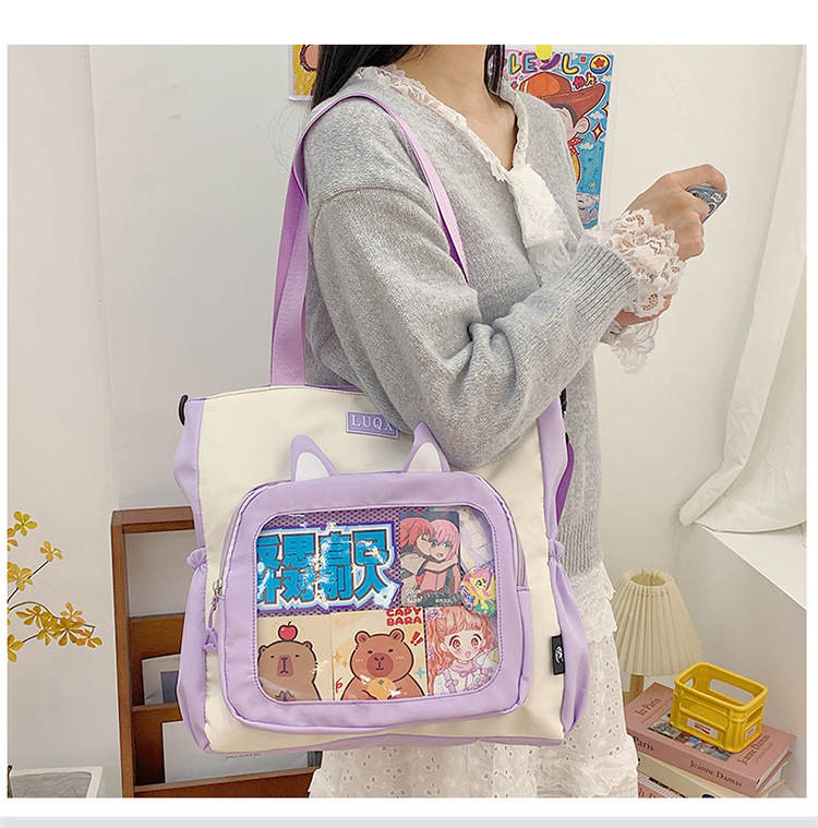 The new cute cartoon printed student bag with a large capacity and transparent student storage single-shoulder bag is selling well for women undefined