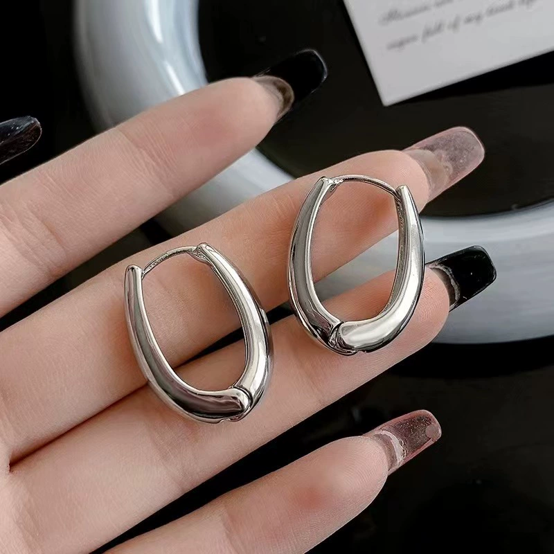 Retro glossy metal fashionable brand earrings, light luxury style, simple and elegant design, internet celebrity