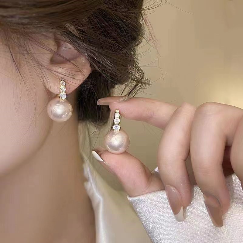 fashionable universal earrings drop-shaped with zircon