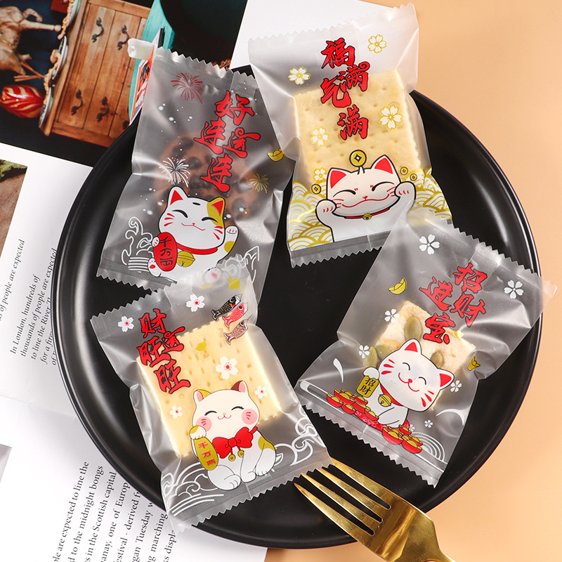 Nuevo copo de nieve bolsa de embalaje crujiente gato de la suerte translúcido helado caramelo leche Jujube cookie máquina sello bolsa al por mayor