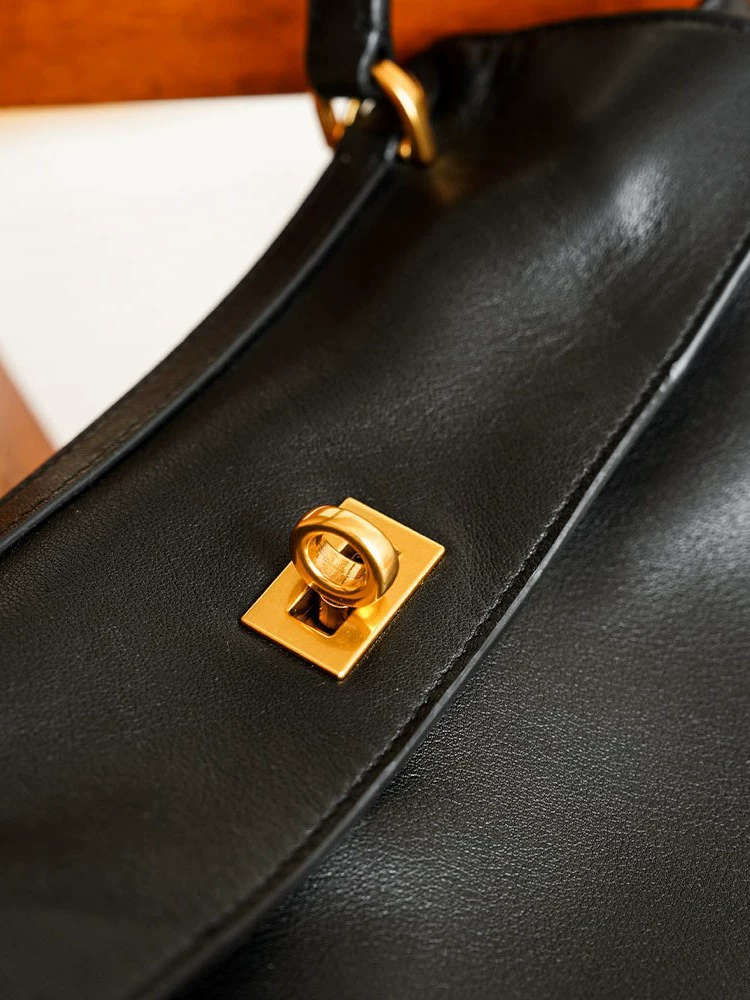 Black capacious one-shoulder bag for men and women