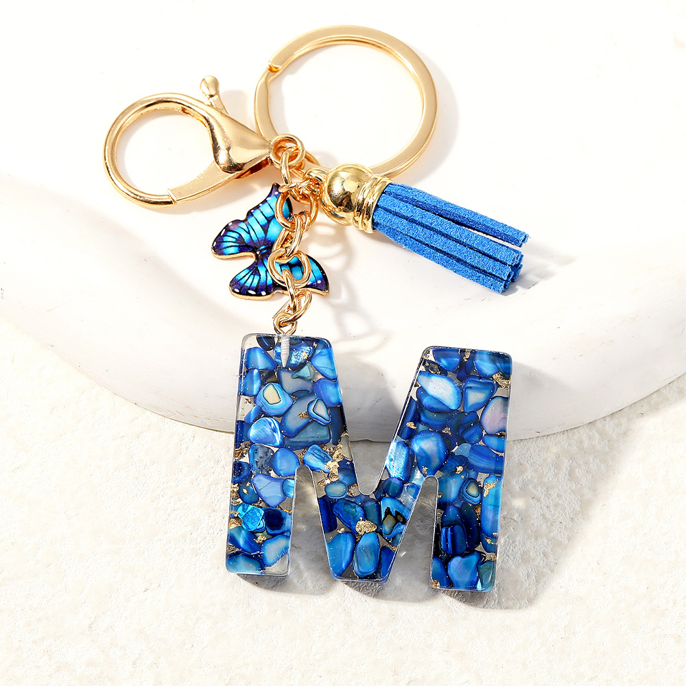 Nuevo transfronterizo mariposa 26 letras inglesas de cristal goteo llavero bolsos accesorios colgante de automóviles