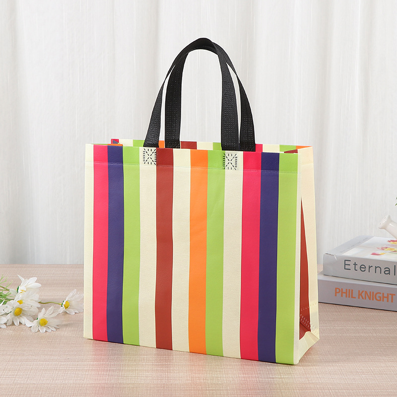 Bolsa de tela no tejida portátil gruesa bolsa de embalaje tridimensional resistente al desgaste de gran capacidad de equipaje de dormitorio de estudiantes bolsa de mano