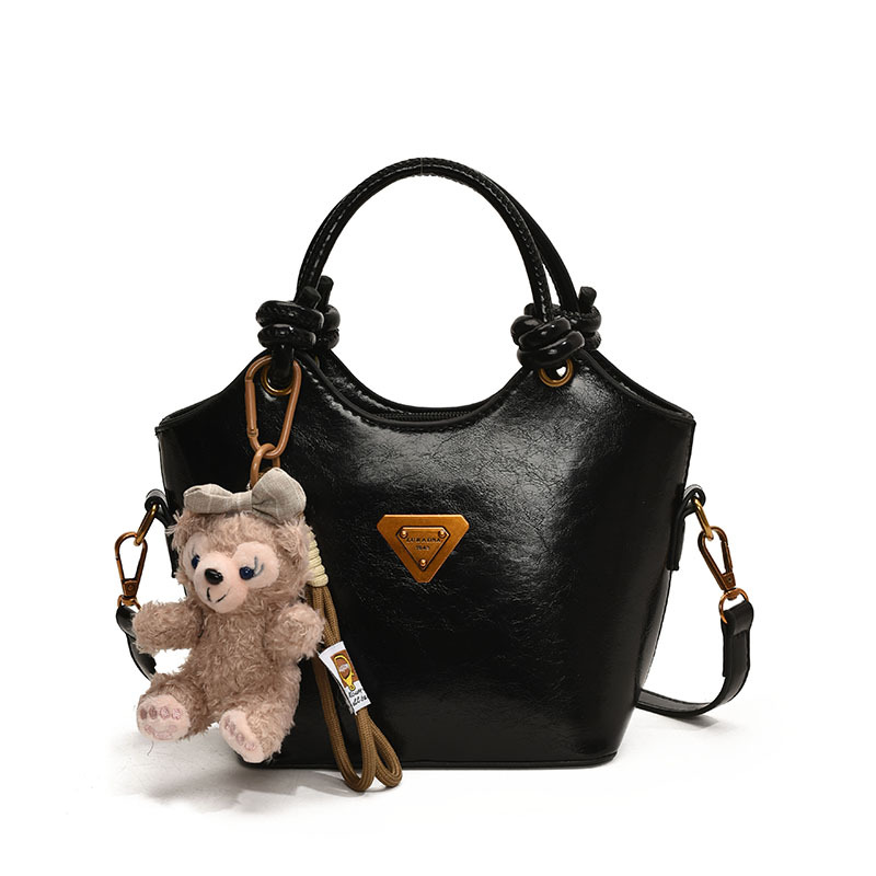 Nicho de diseño bolso de mano mujer 2025 nuevo estilo de moda bolso de hombro de aire extranjero sensación de alto nivel versátil bolso de cubo de transporte