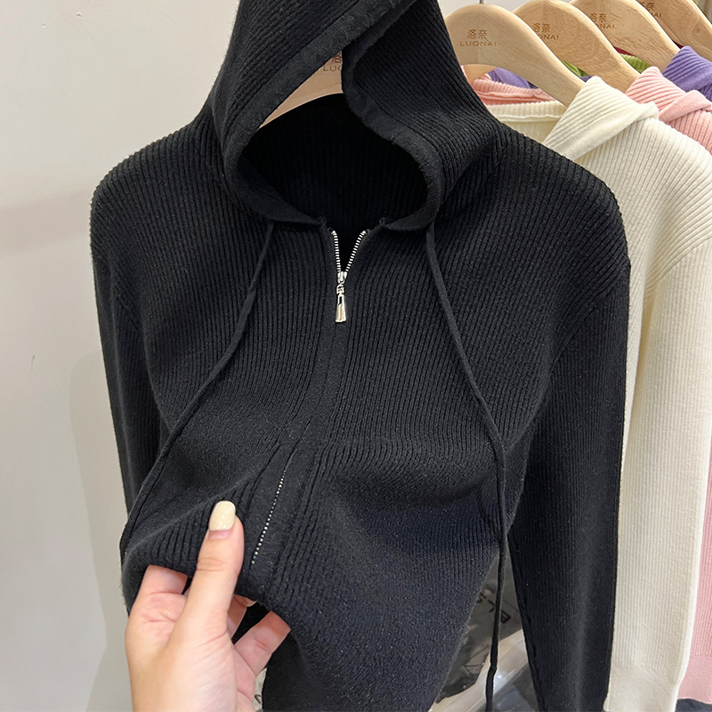 Black knitted autumn sweater with zipper with hood