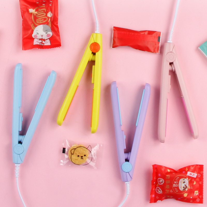 Small household mini portable nougat sealing machine Snowflake packaging bag sugar paper plastic sealing machine electric heating