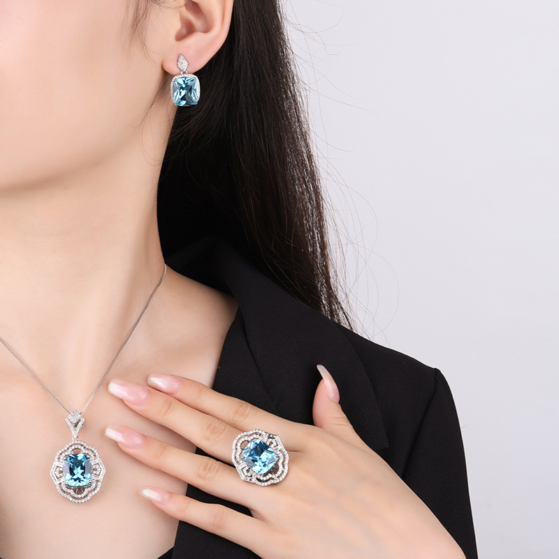 Zhuang Sheng joyería fondo de cobre chapado en oro simulación aguamarina hueco conjunto de las mujeres colgante anillo 4*16 espárragos 12*14