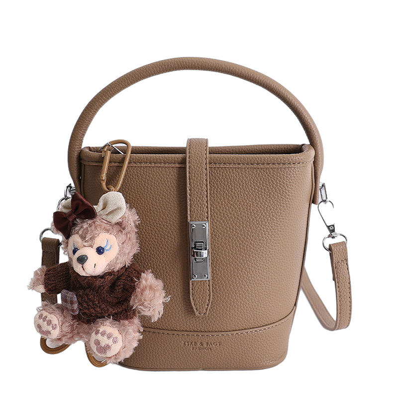 Litchi estampado bolso de cubo de mano mujer 2026 venta caliente nueva moda coreana alta textura mochila de hombro