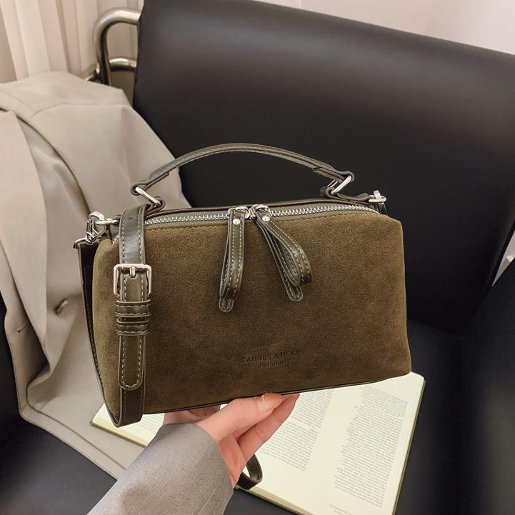 Invierno de moda mochila de textura esmerizada para mujeres 2025 nueva bolsa de hombro de mano casual de alta calidad sensación versátil mochila