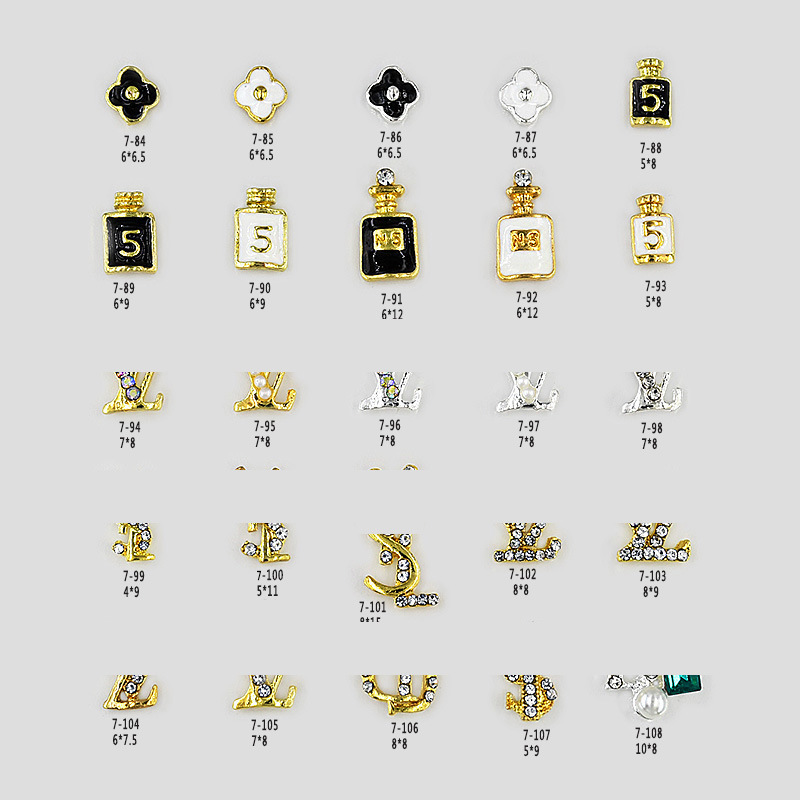 Mixed batch of nail art jewelry Japanese color retention electroplating drop oil four-leaf clover nail stickers Yiwu alloy nail art diamond wholesale