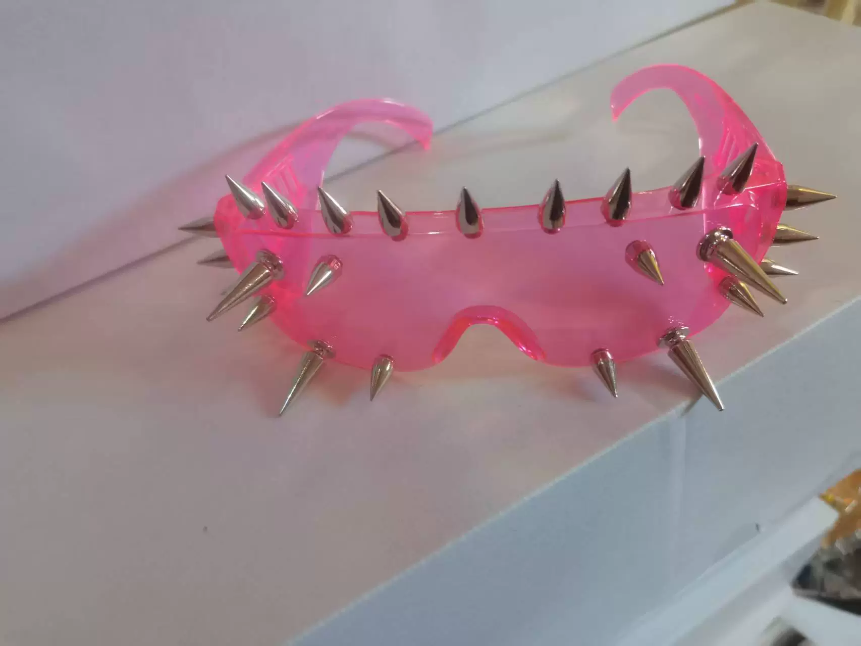 Sunglasses punk style, spike-studded fashion shades, black tinted lens