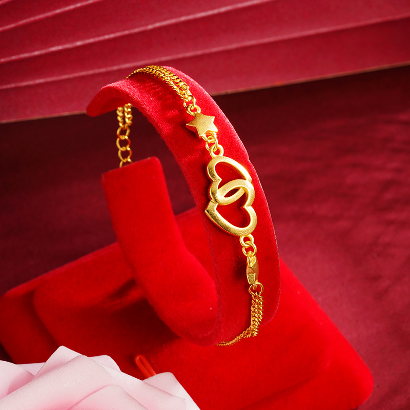 Arena oro pulsera corazón hueco doble corazón desgaste estrella de cinco puntas niñas fresco todo partido simple luz estilo de lujo Yiwu suministro
