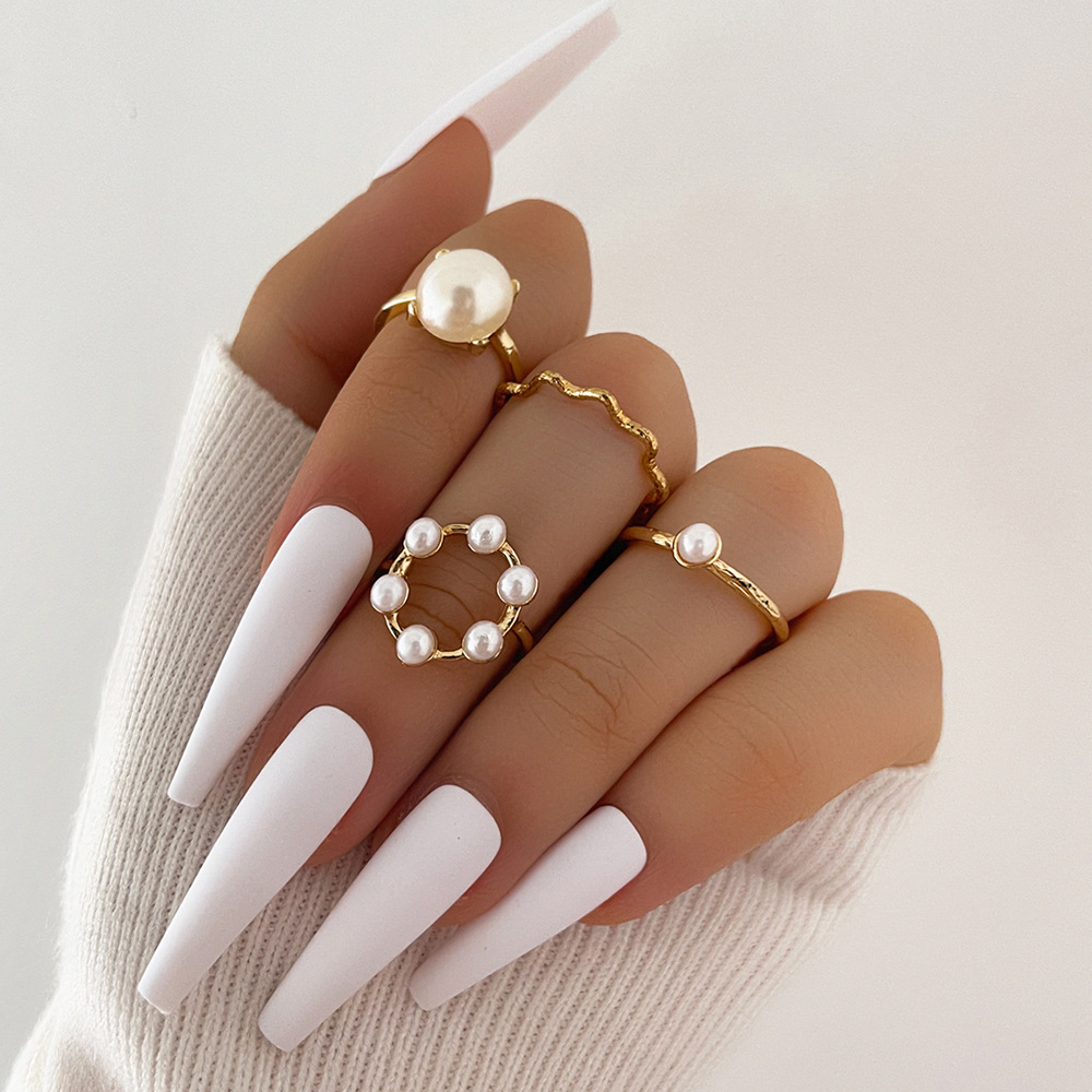 Europe And America Cross Border New Graceful And Fashionable Circle And Pearl Wave Simple Geometric Knuckle Ring Four-piece Set display picture 1