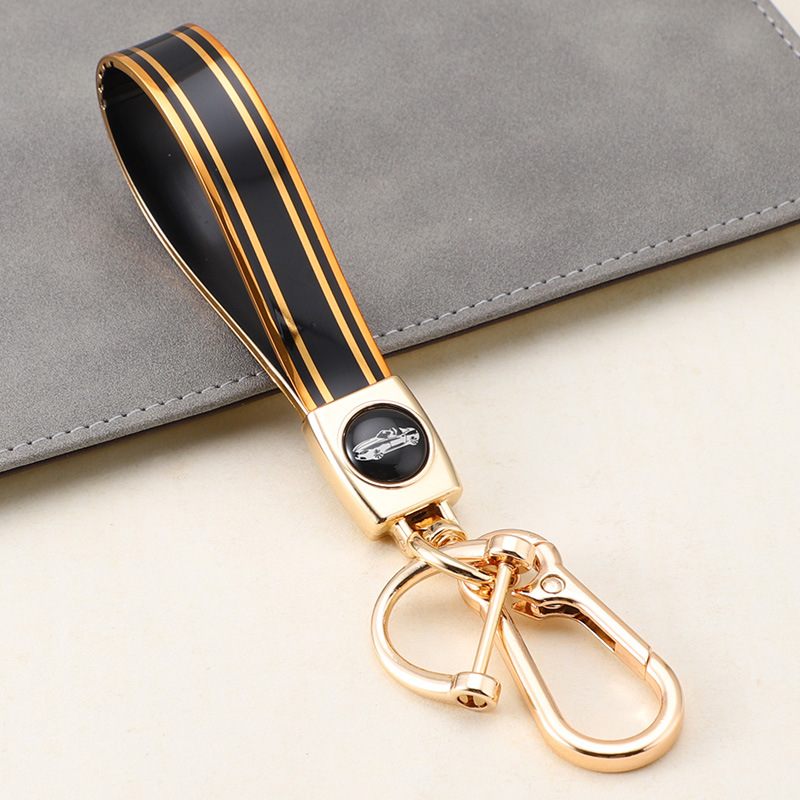 Cuerda de mano de silicona transfronteriza llavero de coche logotipo de coche apellido llavero anti-pérdida llavero de cuerda de mano de silicona duradera