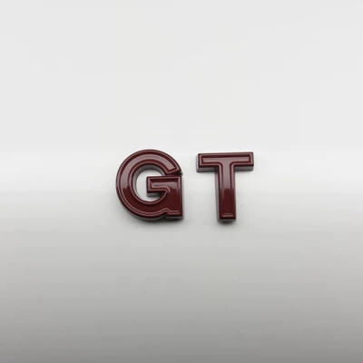 Car logo blackened glossy black car emblem - covered-in-red-gt-lettering