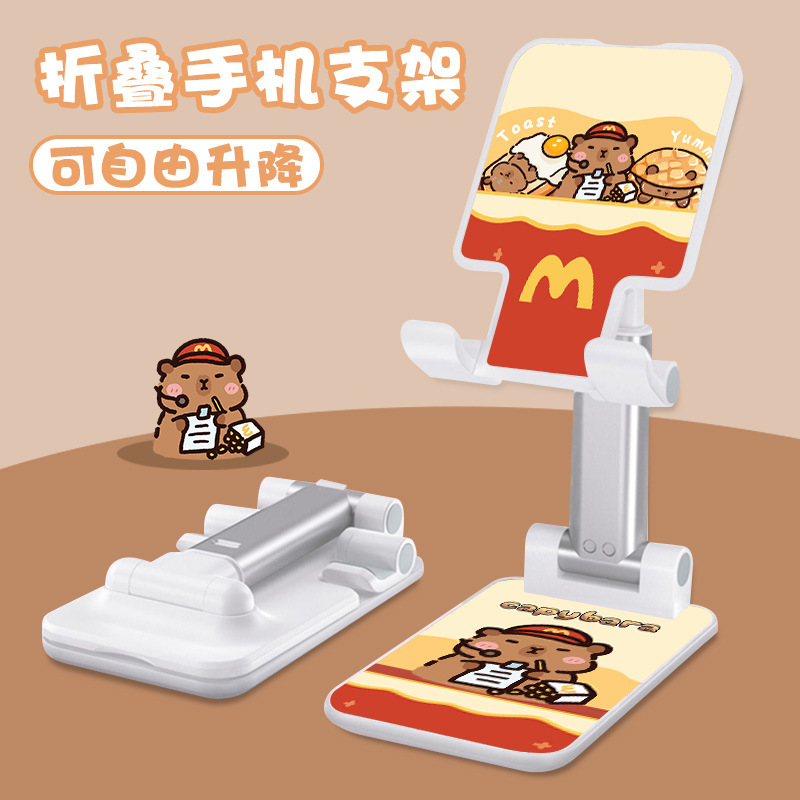 Kt猫の漫画の携帯電話の支柱はタブレットの怠け者のデスクトップの新型の生放送のネット課の神器のベッドの頭の折り畳みの支柱を適用します。|undefined
